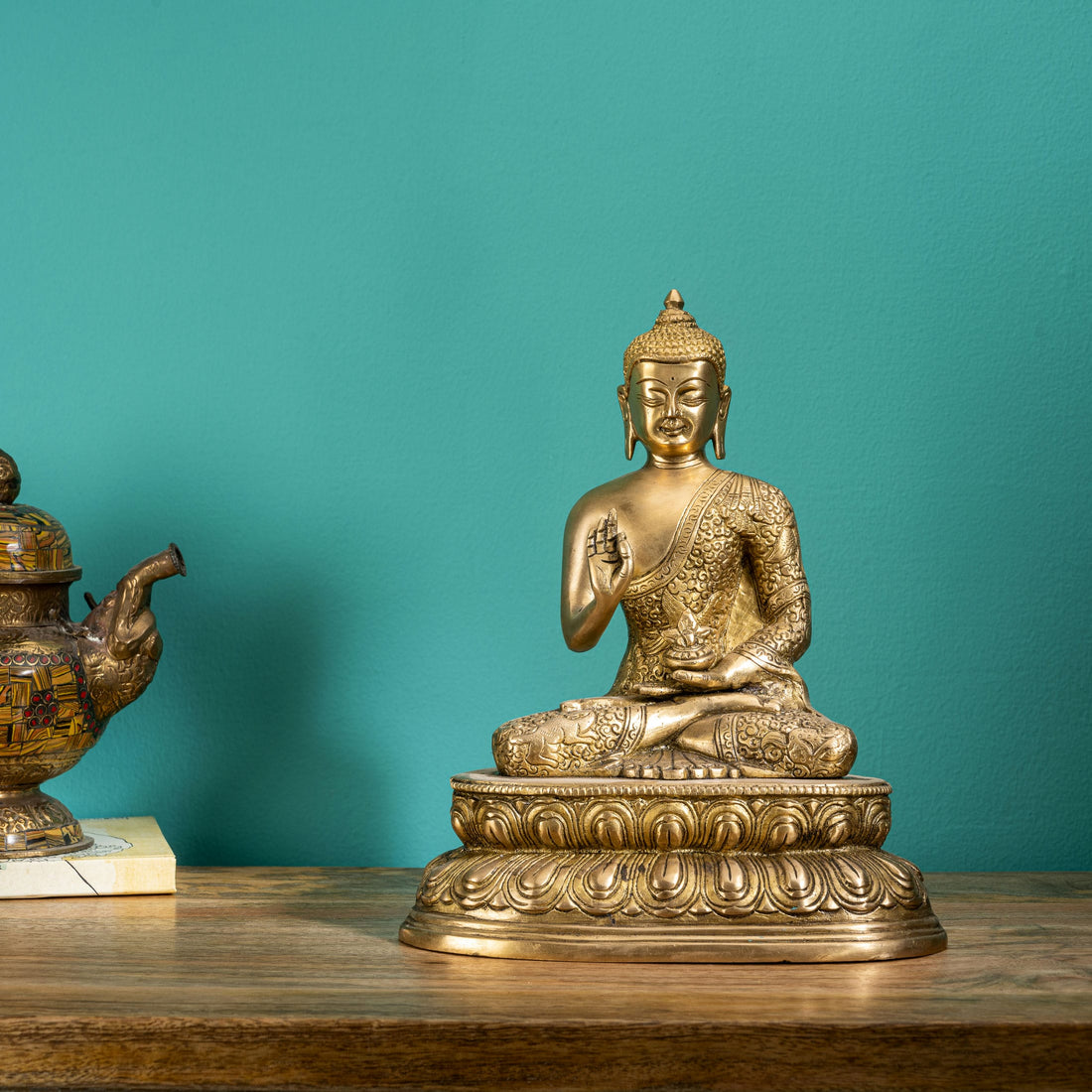 Antique polished brass buddha in abhaya mudra on tiered lotus base