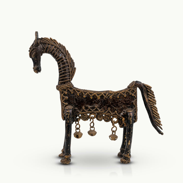 Tall dhokra brass horse sculpture featuring traditional wire-cast texture and hanging bells.