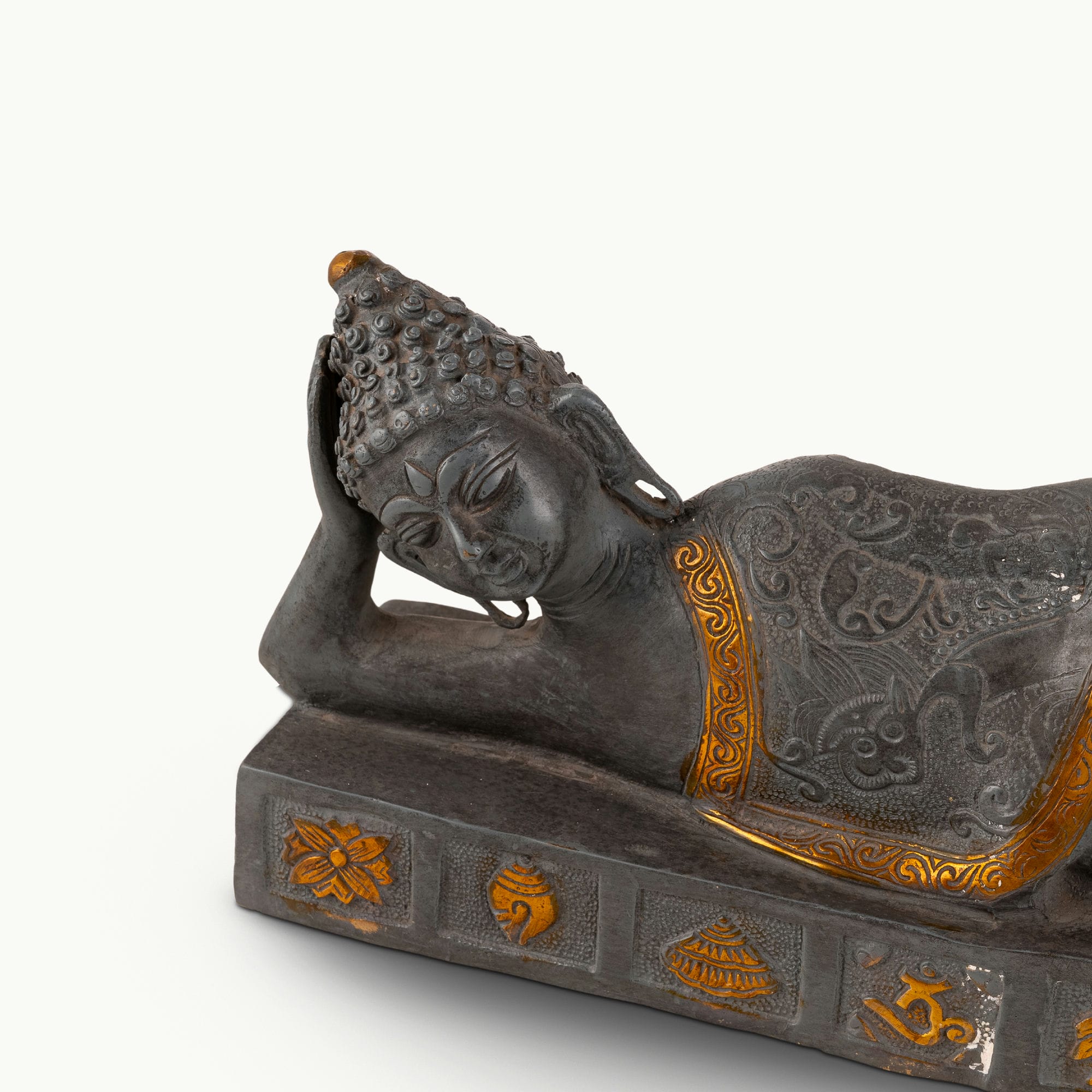 Dual-Tone Reclining Buddha Statue resting on a carved plinth for a meditation console.