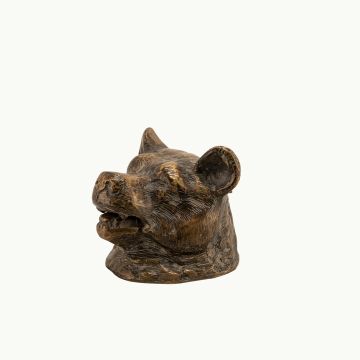 Antiqued Brass Bear Inkwell functioning as a rugged desk accessory on a study desk. 