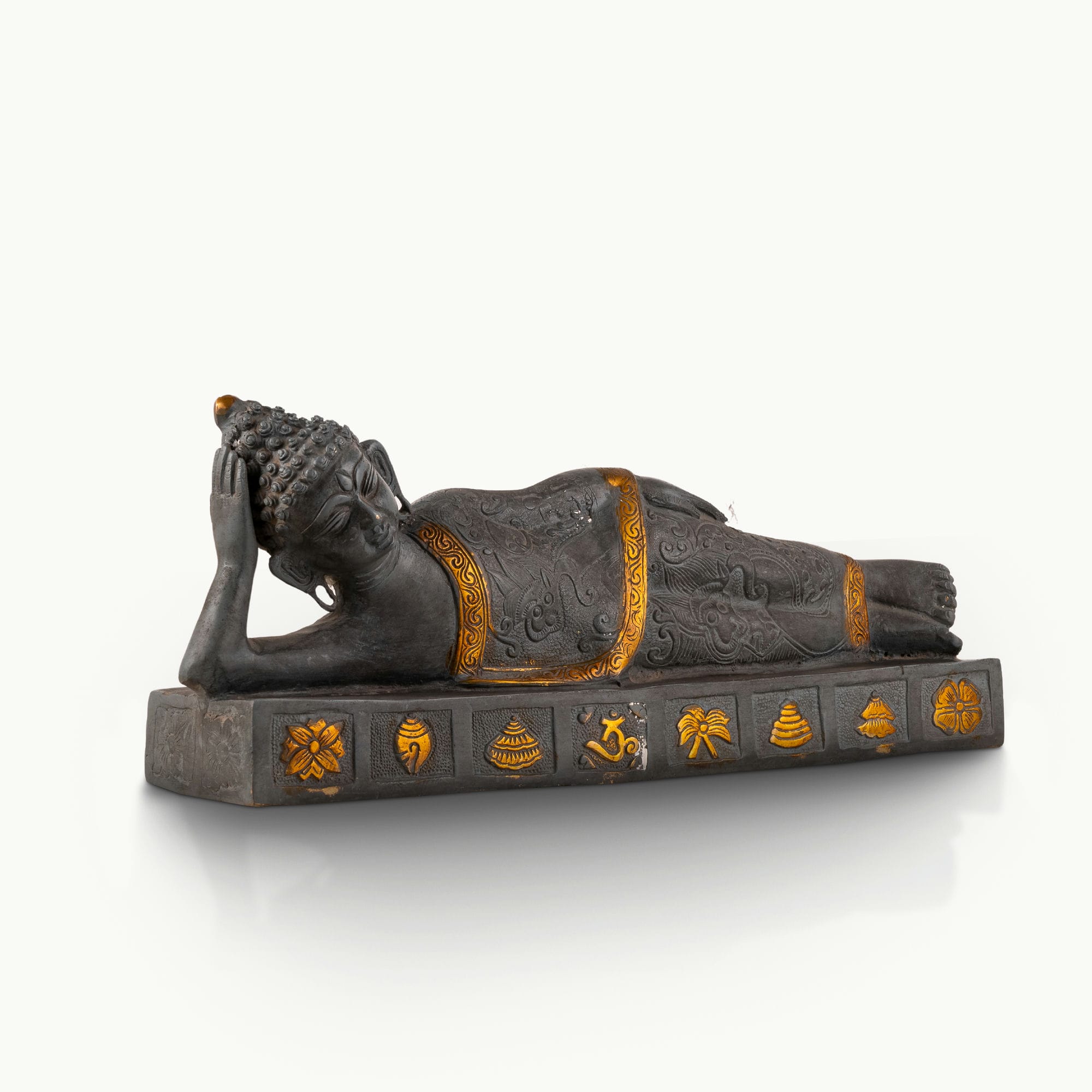 Dual-Tone Reclining Buddha Statue resting on a carved plinth for a meditation console.