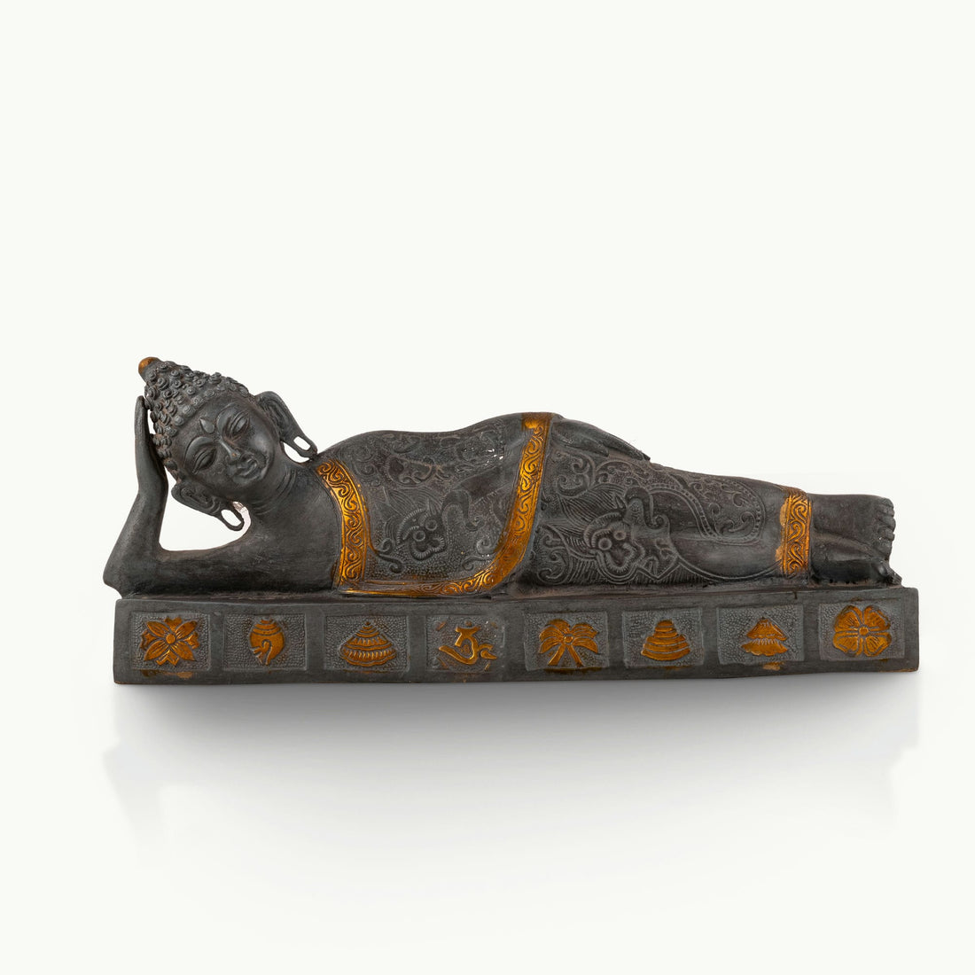 Dual-Tone Reclining Buddha Statue resting on a carved plinth for a meditation console.