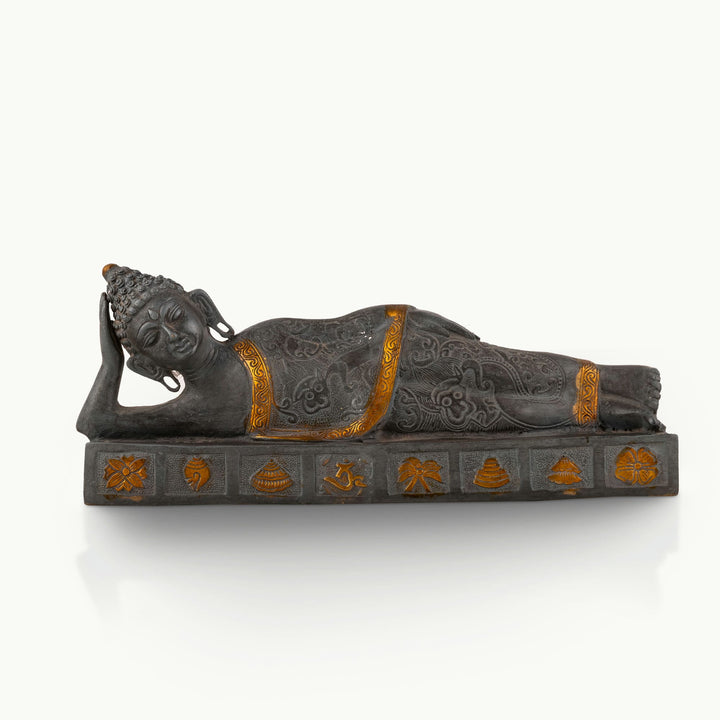 Dual-Tone Reclining Buddha Statue resting on a carved plinth for a meditation console.