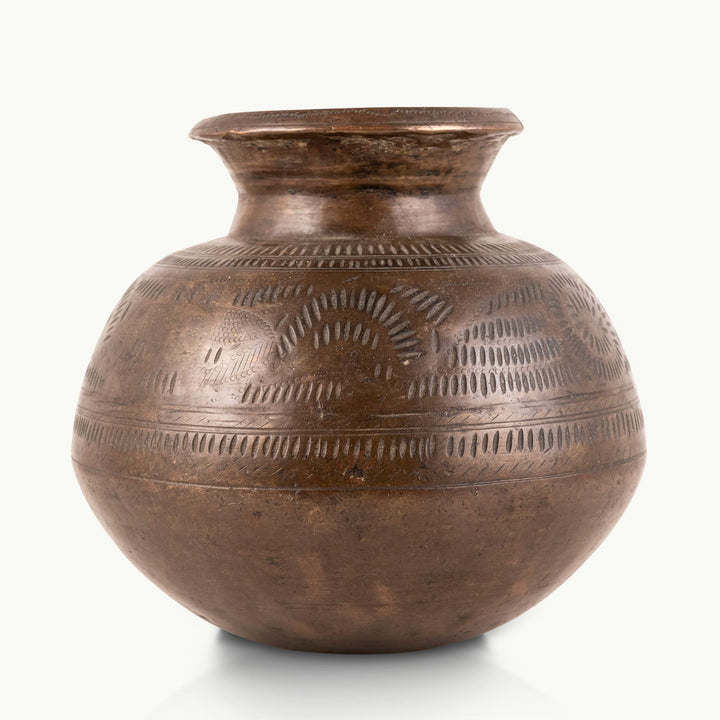 Stamped Antique Brass Water Pot covered in rhythmic dashes for a raw concrete console.