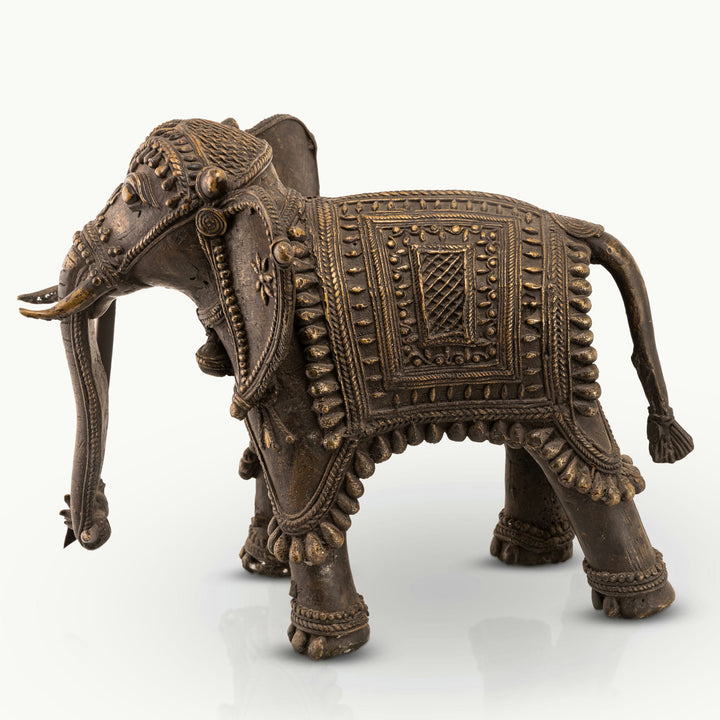 Brass Ornate Elephant Sculpture with a downward-curving trunk for a solid mahogany desk. 