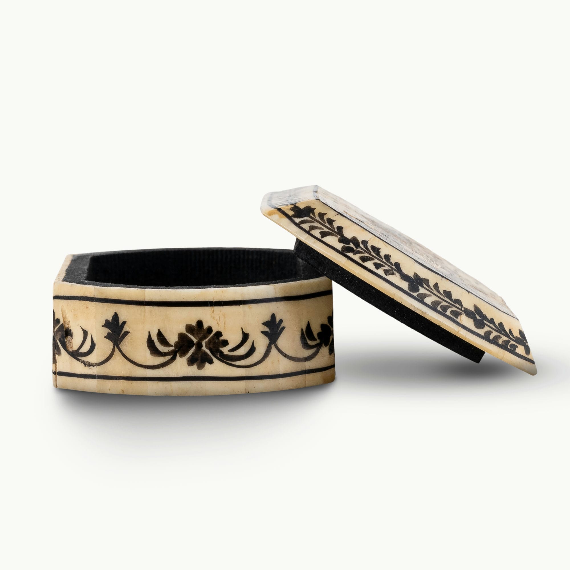 Portrait painted camel bone box featuring a Rajput noblewoman and black floral borders.