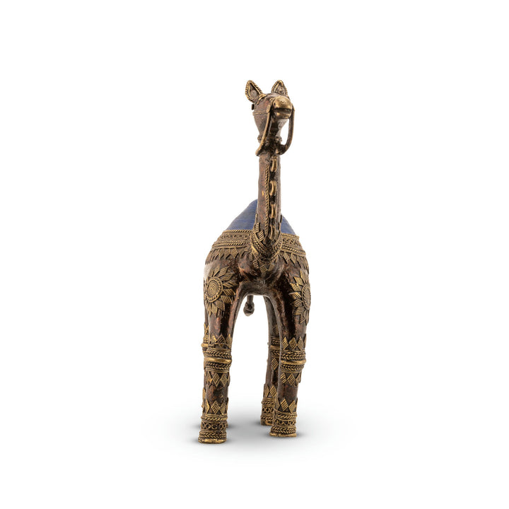 Premium metal desert wanderer statue featuring deep sunburst etchings for a wooden bookshelf or office display.