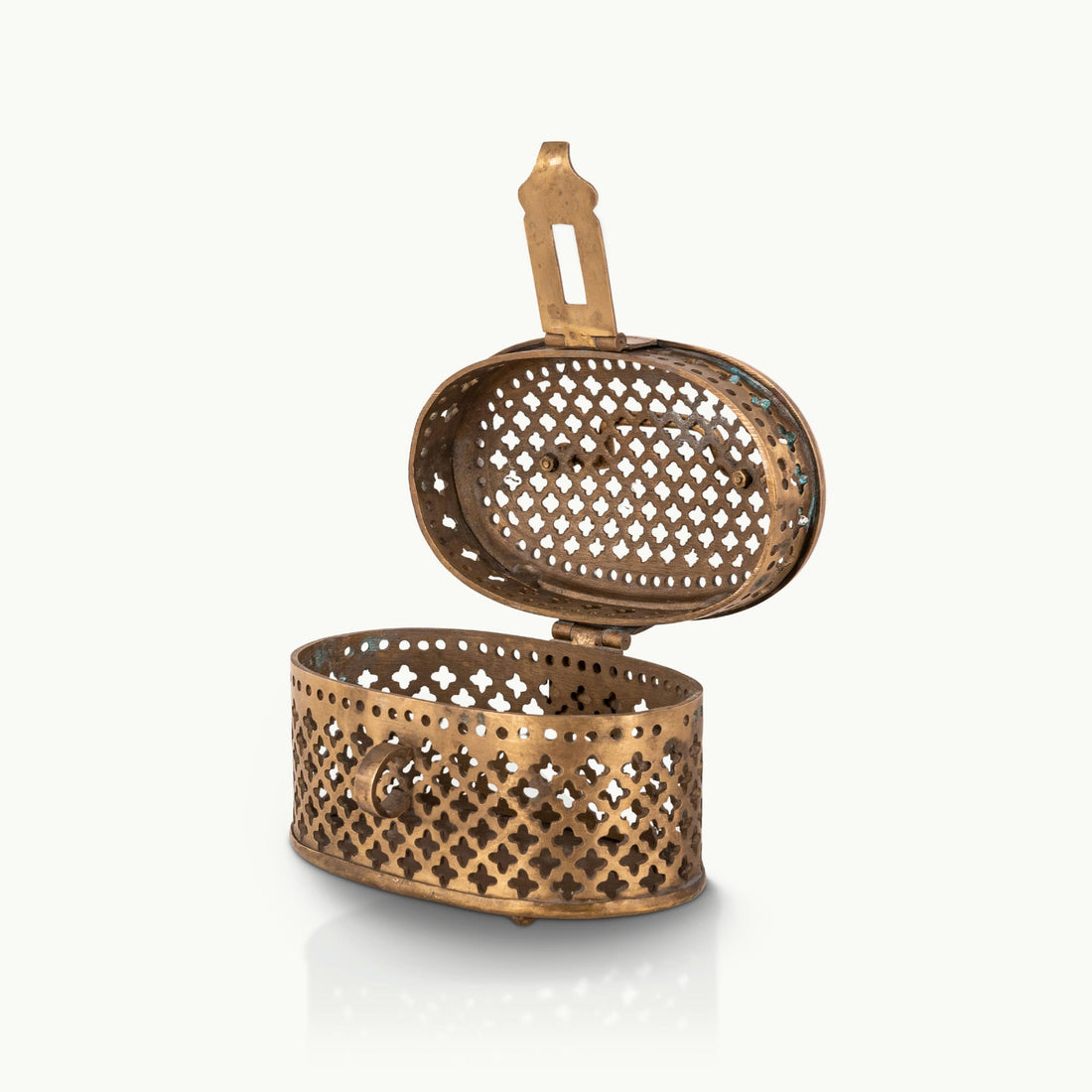 Antique Brass Pierced Oval Box featuring a delicate quatrefoil lattice for a walnut dresser.