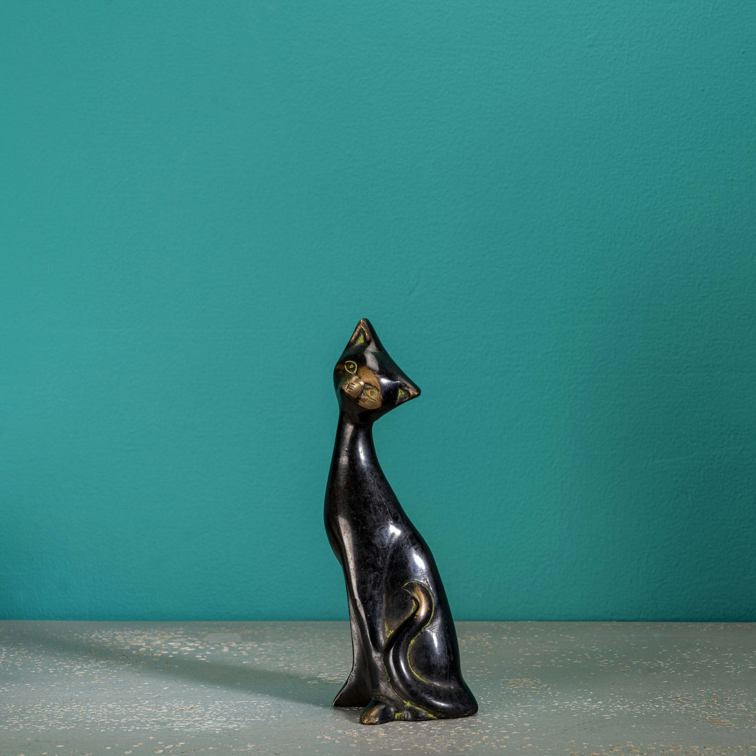 Stylized Black Brass Cat Sculpture: The Obsidian Sentinel