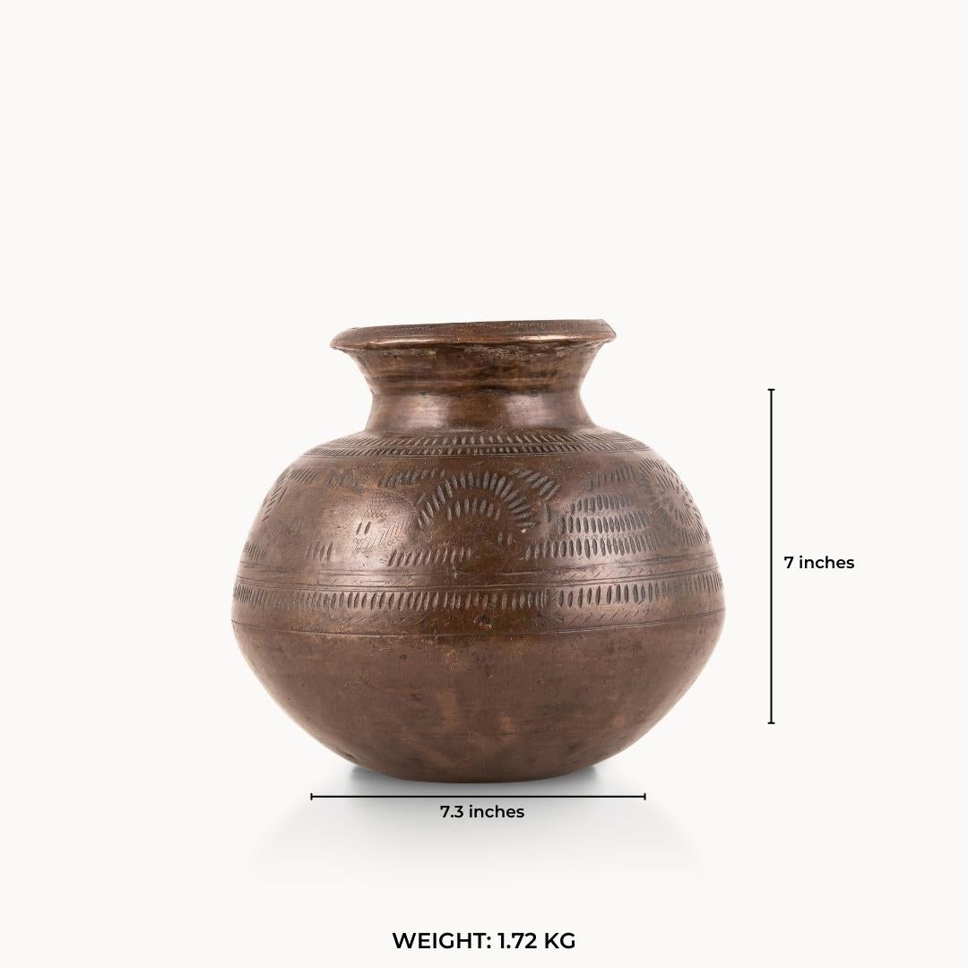 Stamped Antique Brass Water Pot covered in rhythmic dashes for a raw concrete console.