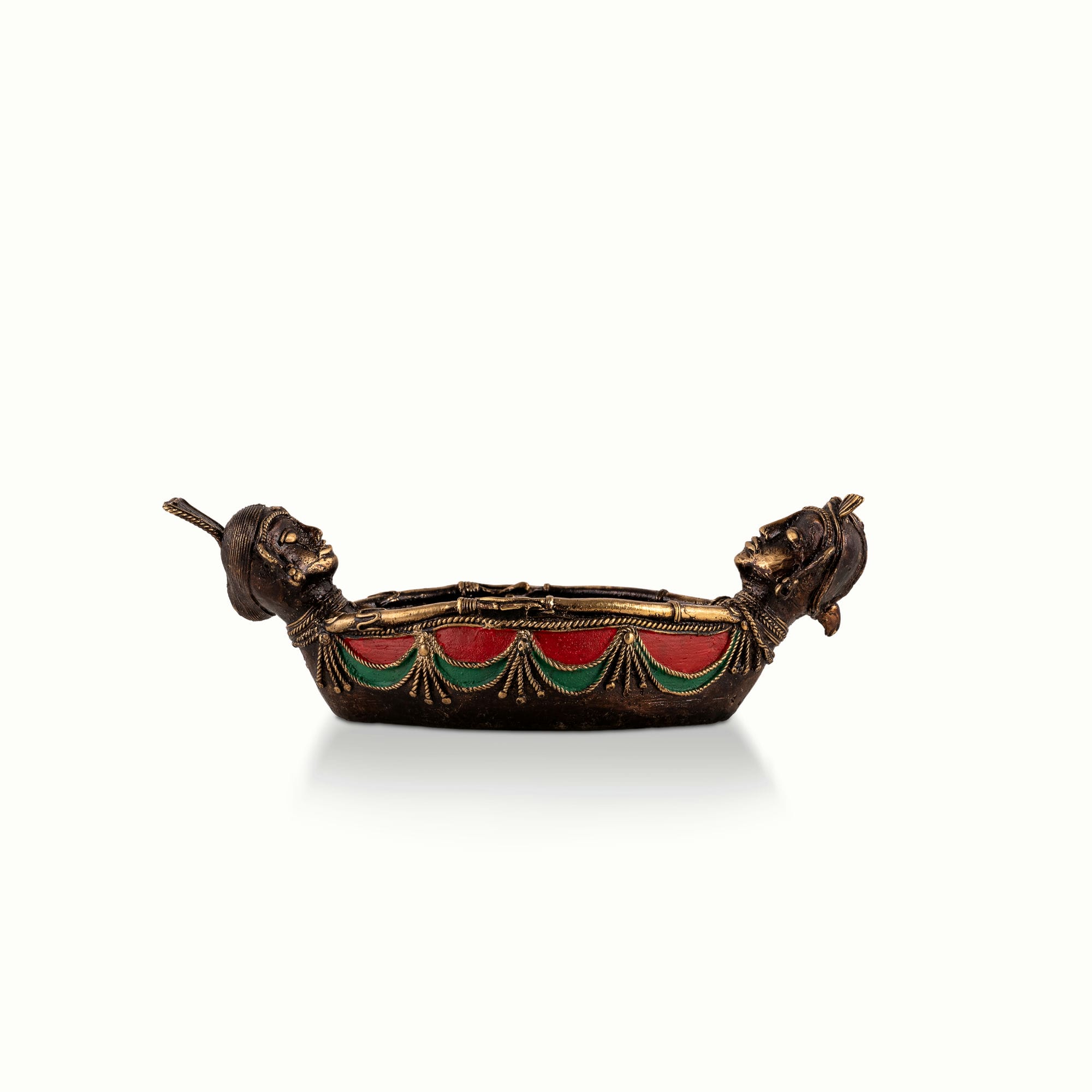 Painted Brass Boat Bowl acting as a catchall tray on a solid wood credenza. 