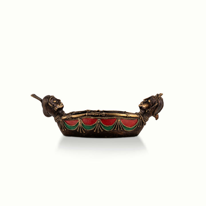 Painted Brass Boat Bowl acting as a catchall tray on a solid wood credenza. 