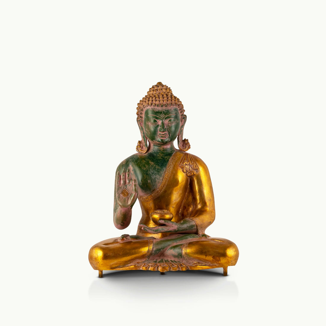 Green Dual-Tone Brass Buddha displaying the Abhaya mudra for an expansive living room.