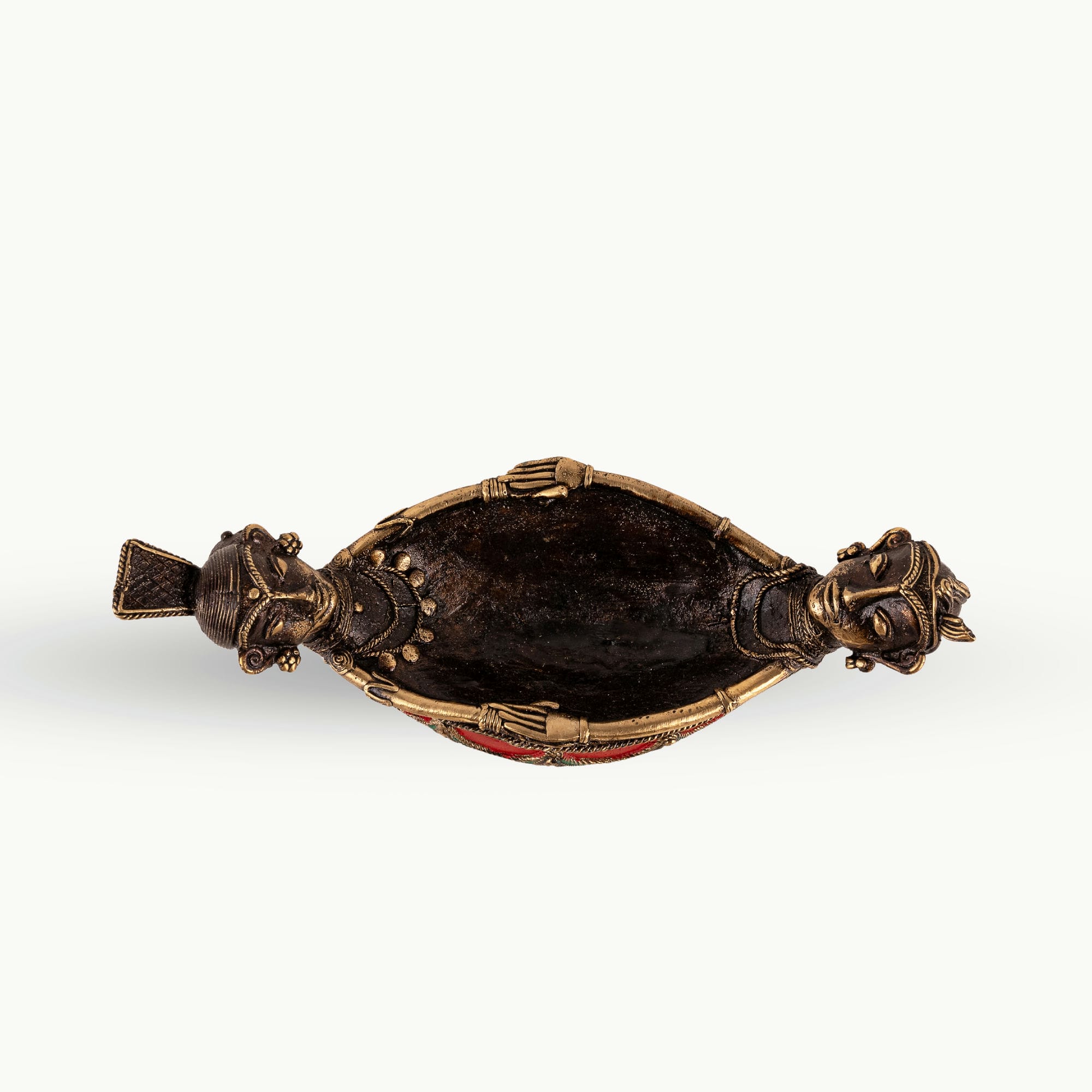 Painted Brass Boat Bowl acting as a catchall tray on a solid wood credenza. 