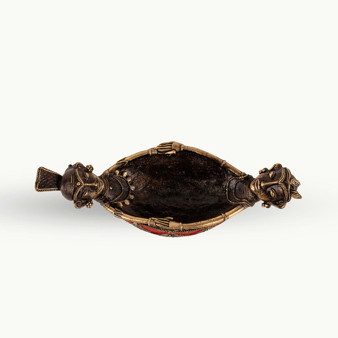Painted Brass Boat Bowl acting as a catchall tray on a solid wood credenza. 