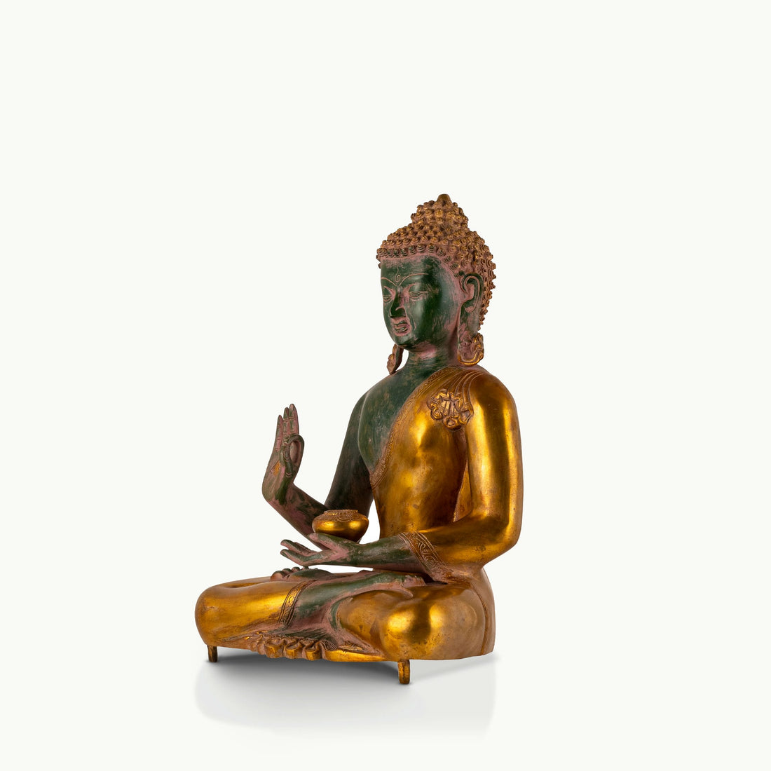 Green Dual-Tone Brass Buddha displaying the Abhaya mudra for an expansive living room.