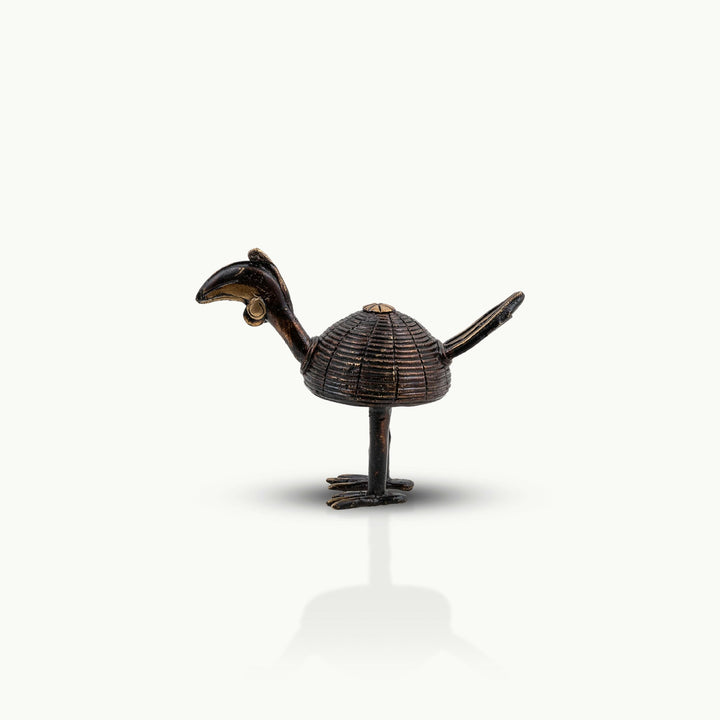 Dhokra brass hornbill pair featuring dark earthen patination and golden beak highlights.