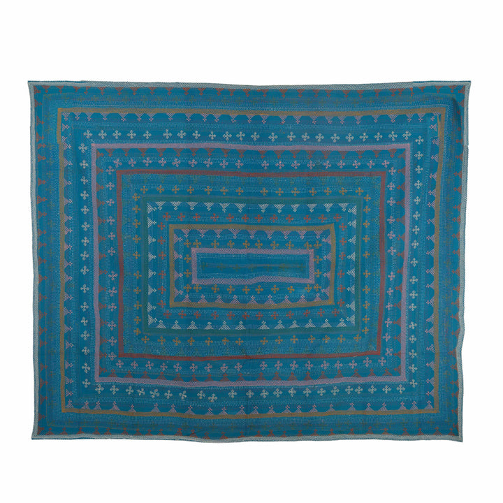 Geometric kantha cotton bedcover highlighting dense multi-coloured running stitches across a vibrant peacock-teal base.