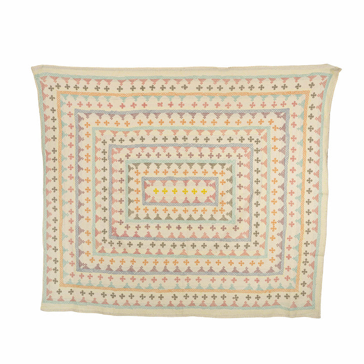 Pastel geometric kantha bedcover highlighting delicate peach and mint hand-stitched borders for a serene master suite.