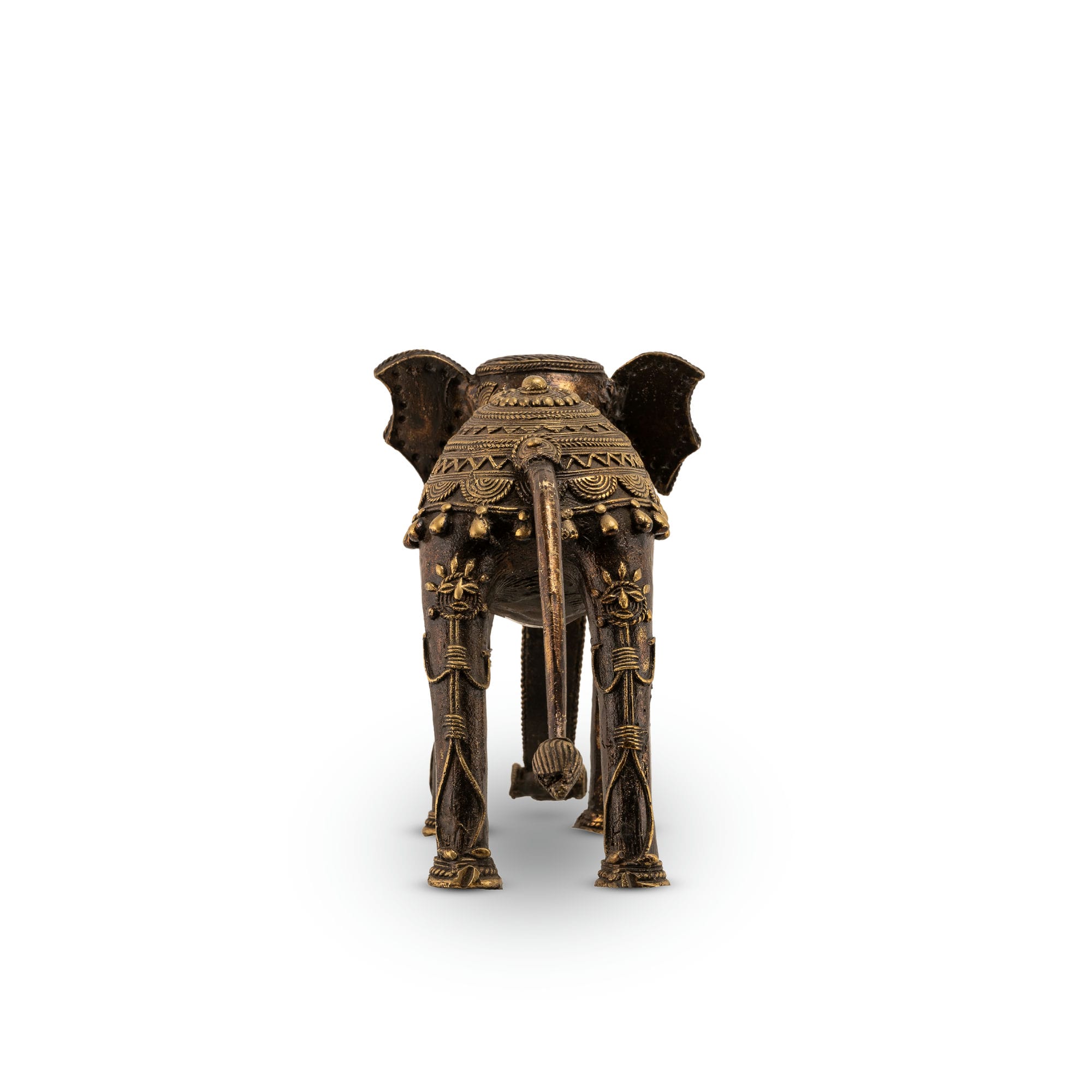 Indian metal ceremonial beast decor featuring a stylized elongated trunk for a wide wooden bookshelf or traditional home decor.