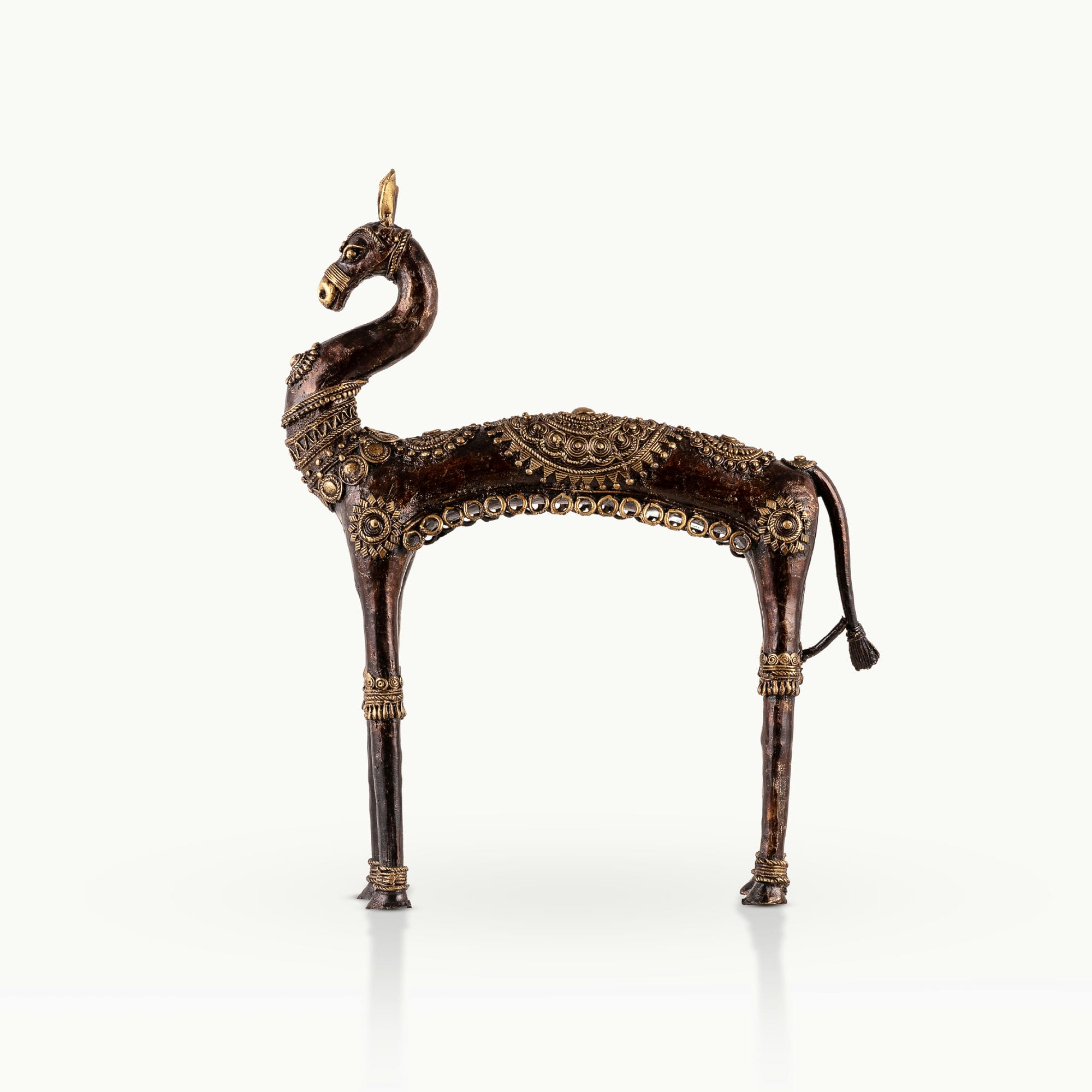 Dhokra Brass Horse Sculpture featuring an elongated arch on a minimalist wooden credenza. 