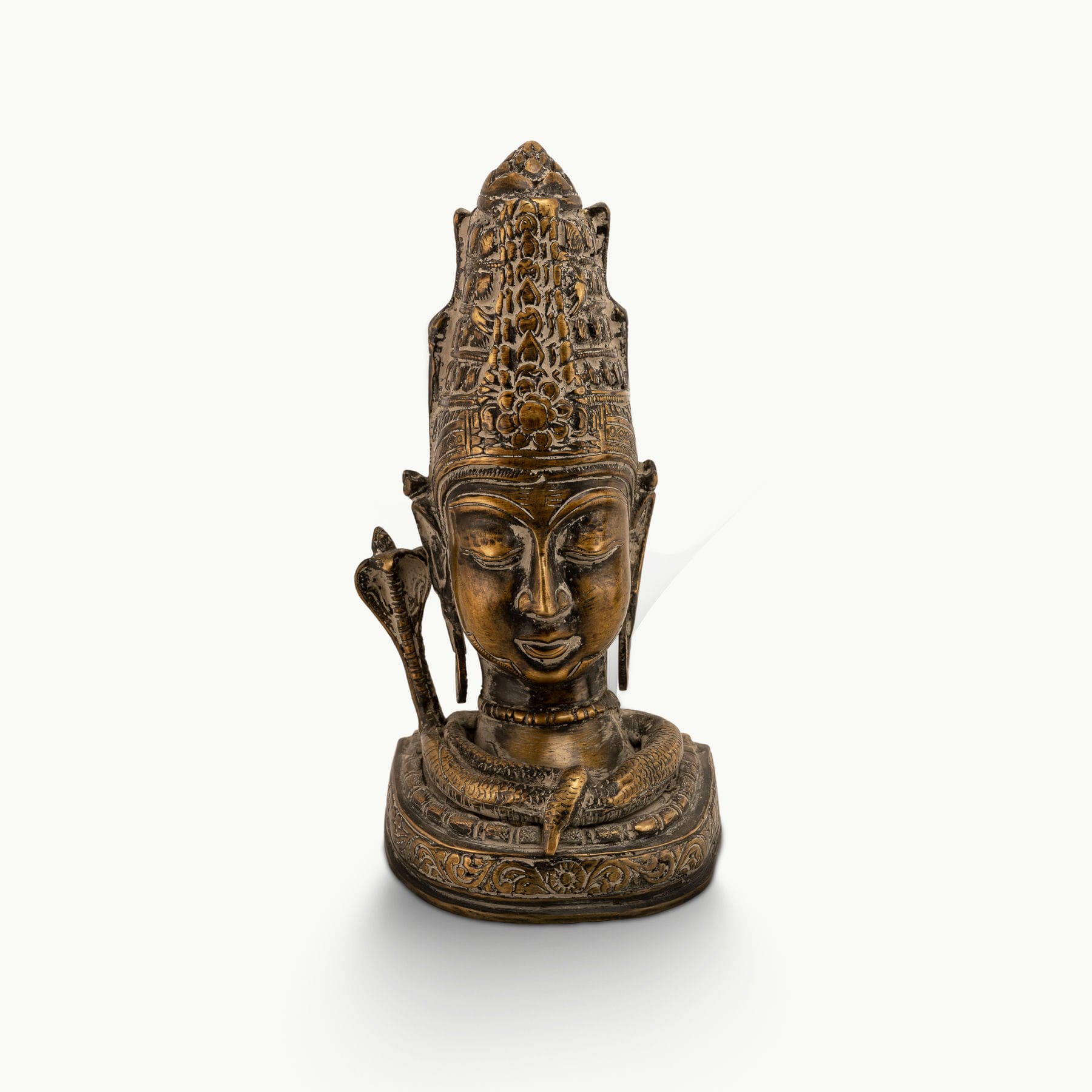 Distressed Brass Shiva Bust depicting the supreme ascetic on a meditation altar