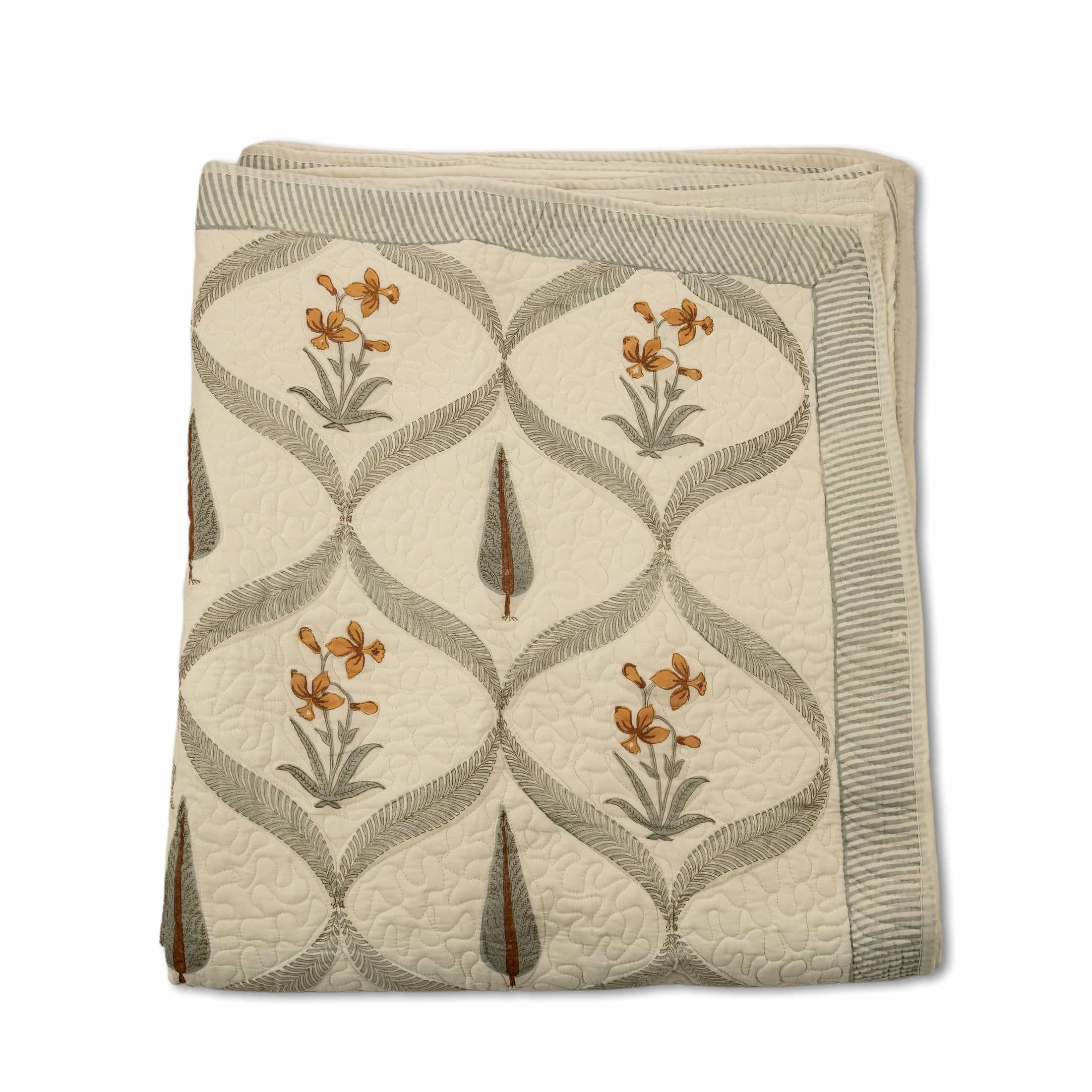 Hand-stitched cotton quilted coverlet with feather and blossom ogee pattern