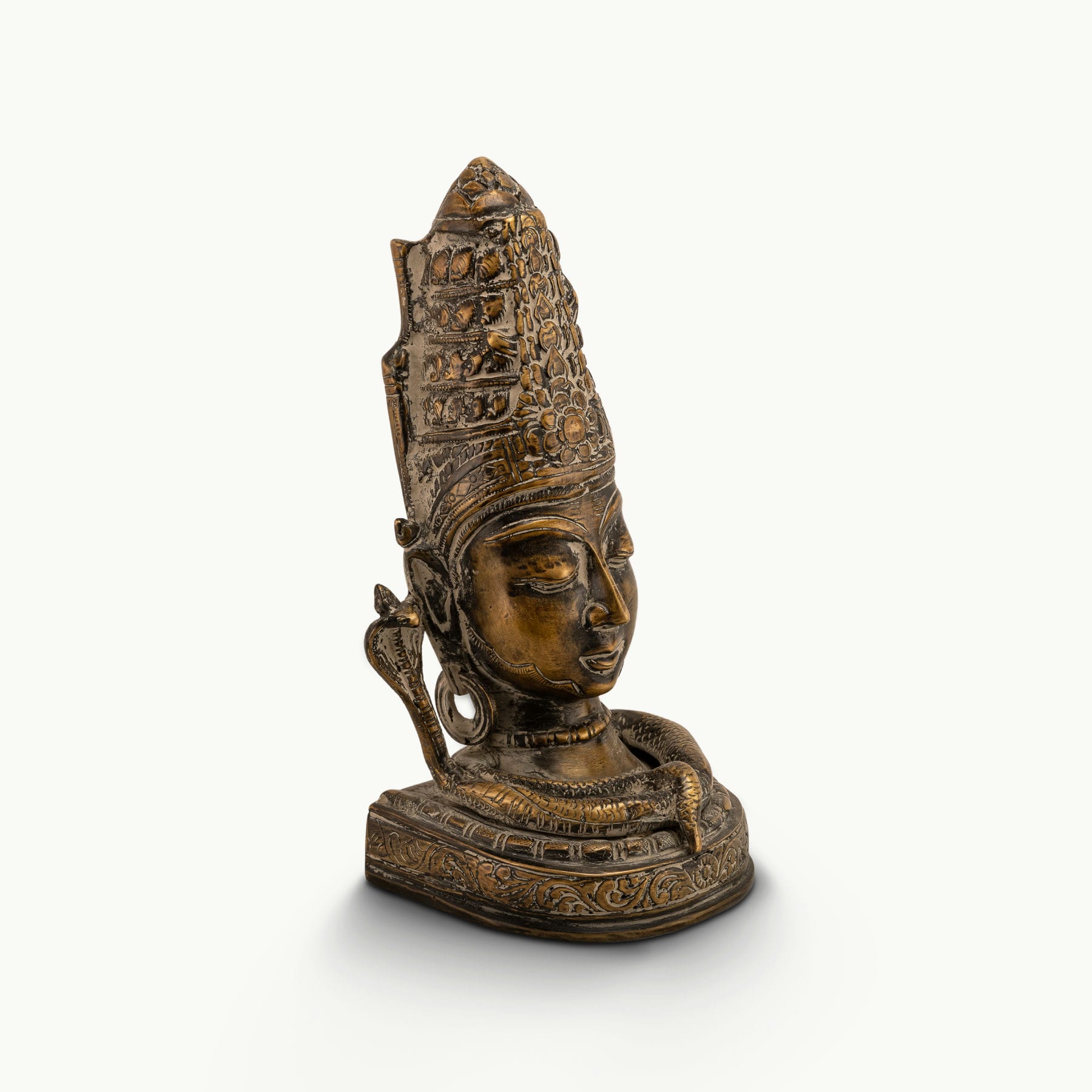Distressed Brass Shiva Bust depicting the supreme ascetic on a meditation altar