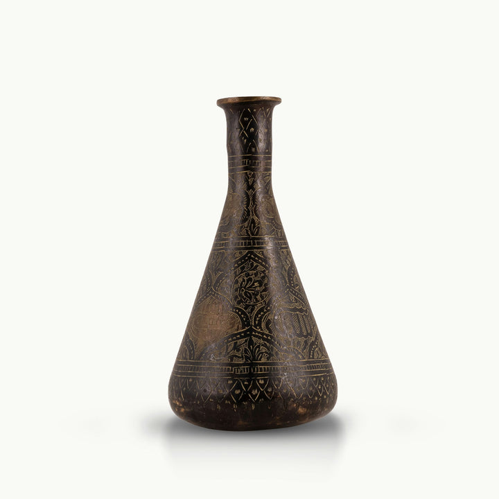Engraved Brass Decorative Vase showcasing intricate stonework motifs on a neutral room console. 
