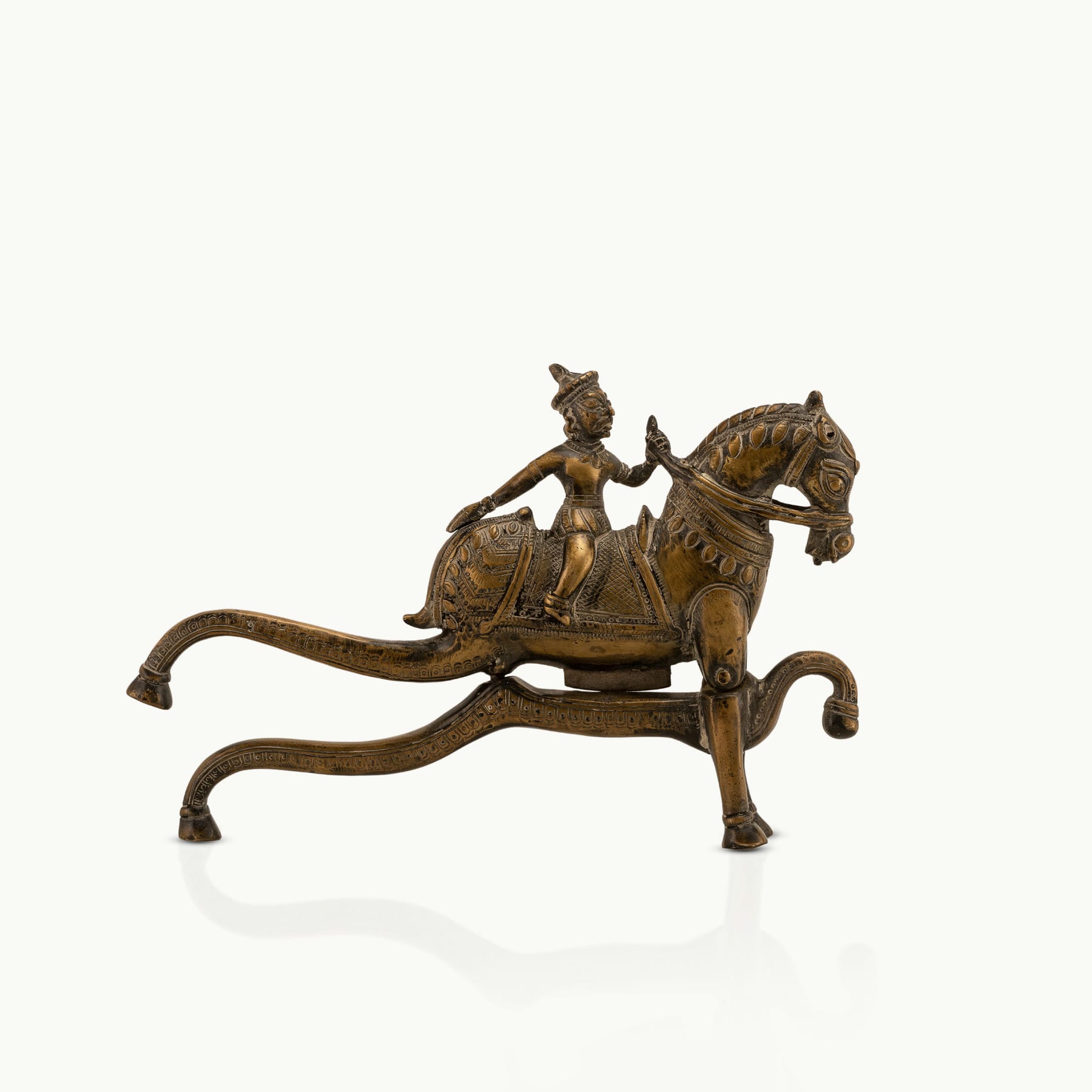 Antique Brass Horse Nutcracker showing mechanical grandeur on a living room coffee table. 