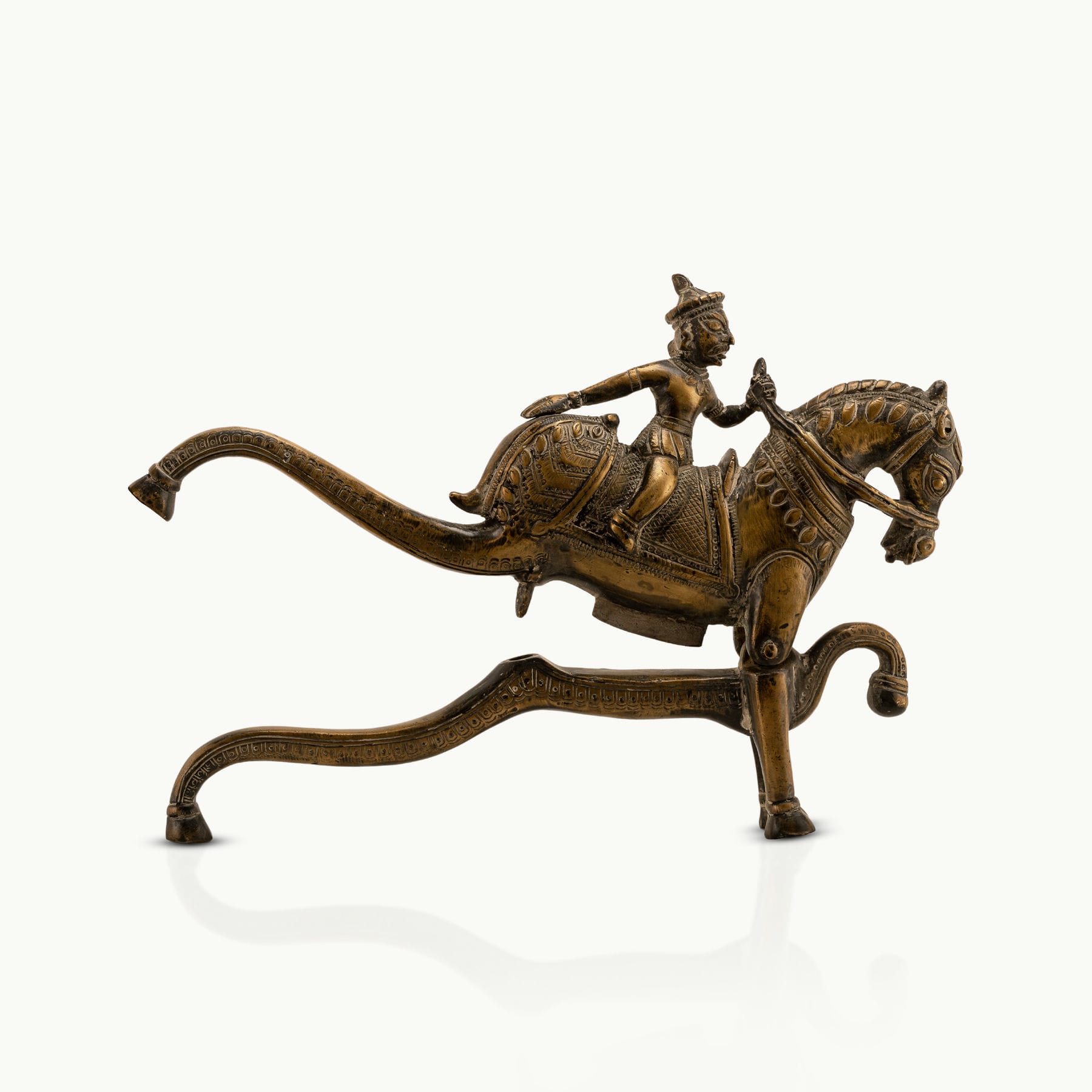 Antique Brass Horse Nutcracker showing mechanical grandeur on a living room coffee table. 