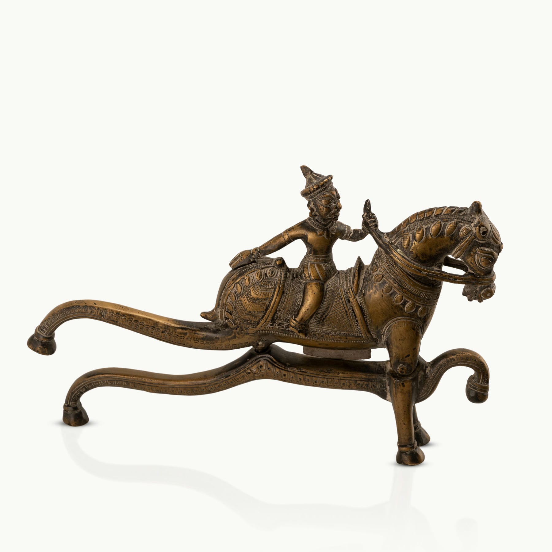 Antique Brass Horse Nutcracker showing mechanical grandeur on a living room coffee table. 