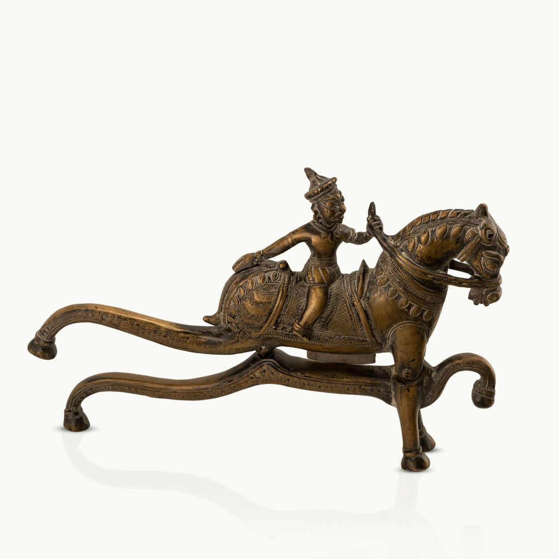 Antique Brass Horse Nutcracker showing mechanical grandeur on a living room coffee table. 