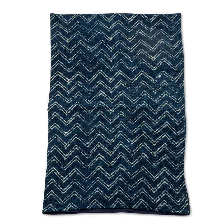 Indigo tribal block-print bedcover with cream chevron patterns and dotted borders, featuring a heavy jute-like texture.