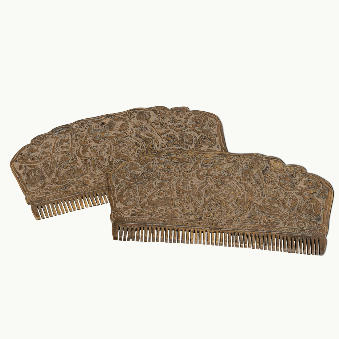 Engraved Brass Decorative Comb displaying a dense narrative tapestry on a mirrored dressing table. 