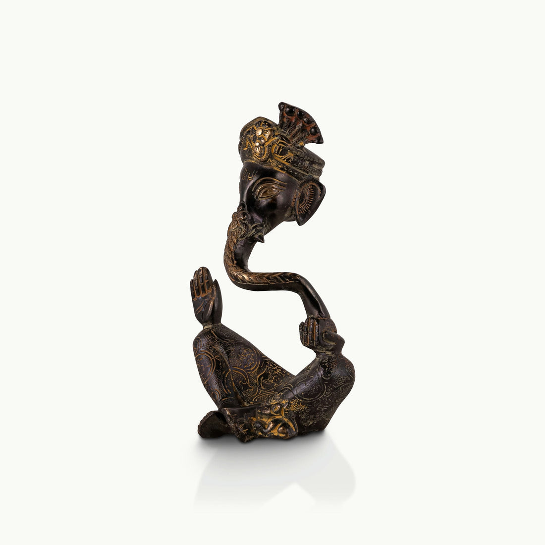 Stylized Black Brass Ganesha shaped in a sweeping continuous loop for a floating black console.