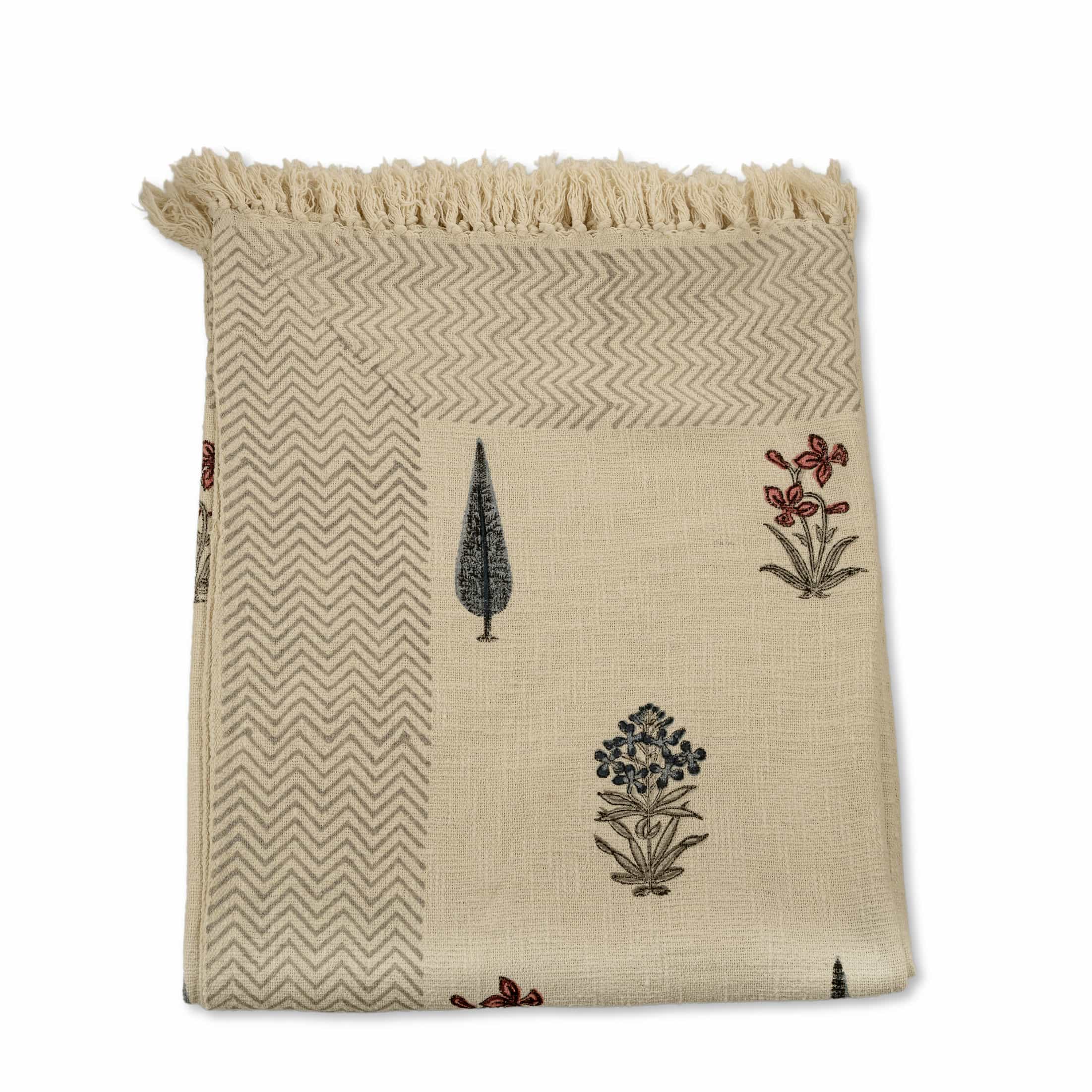 Hand-block printed cotton coverlet with scattered poppy and cypress motifs