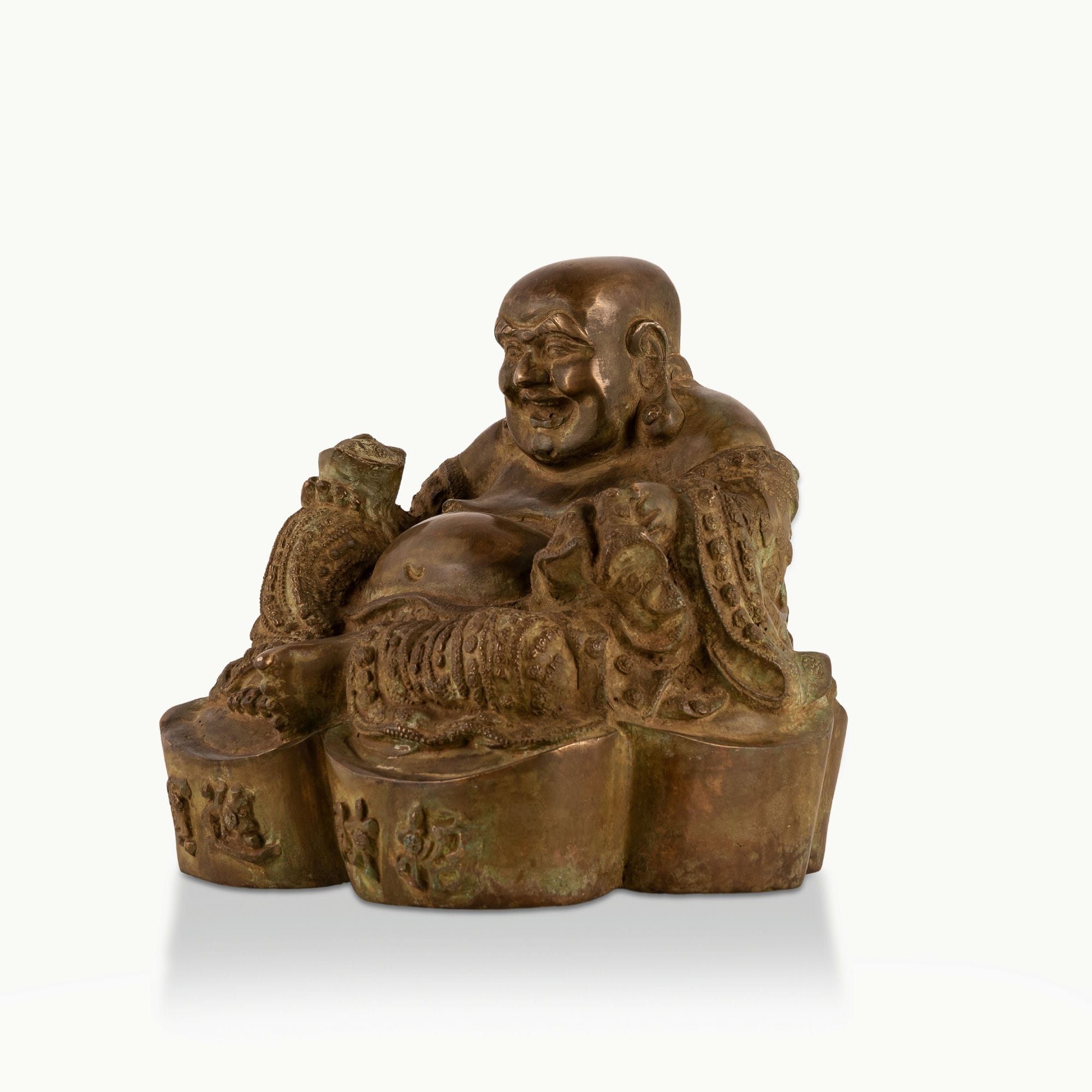 Heavy Brass Laughing Buddha Statue offering joyous abundance in a living room corner. 