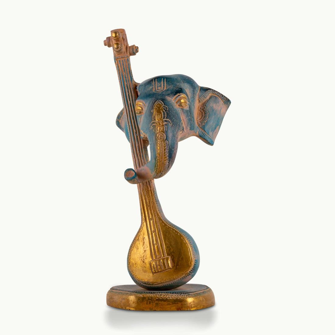 Painted Brass Musical Ganesha Sculpture integrated with a Veena on a minimalist credenza