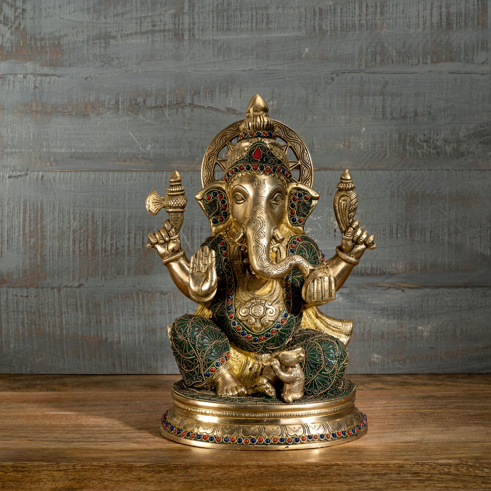 Large brass Ganpati idol sitting gracefully with a loyal mouse vahana, perfect for a traditional home altar or Diwali gift.