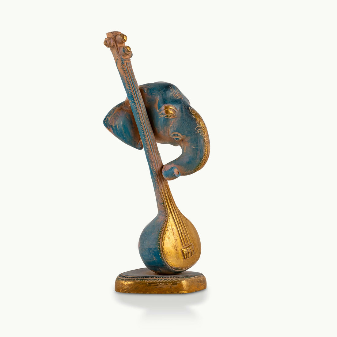 Painted Brass Musical Ganesha Sculpture integrated with a Veena on a minimalist credenza
