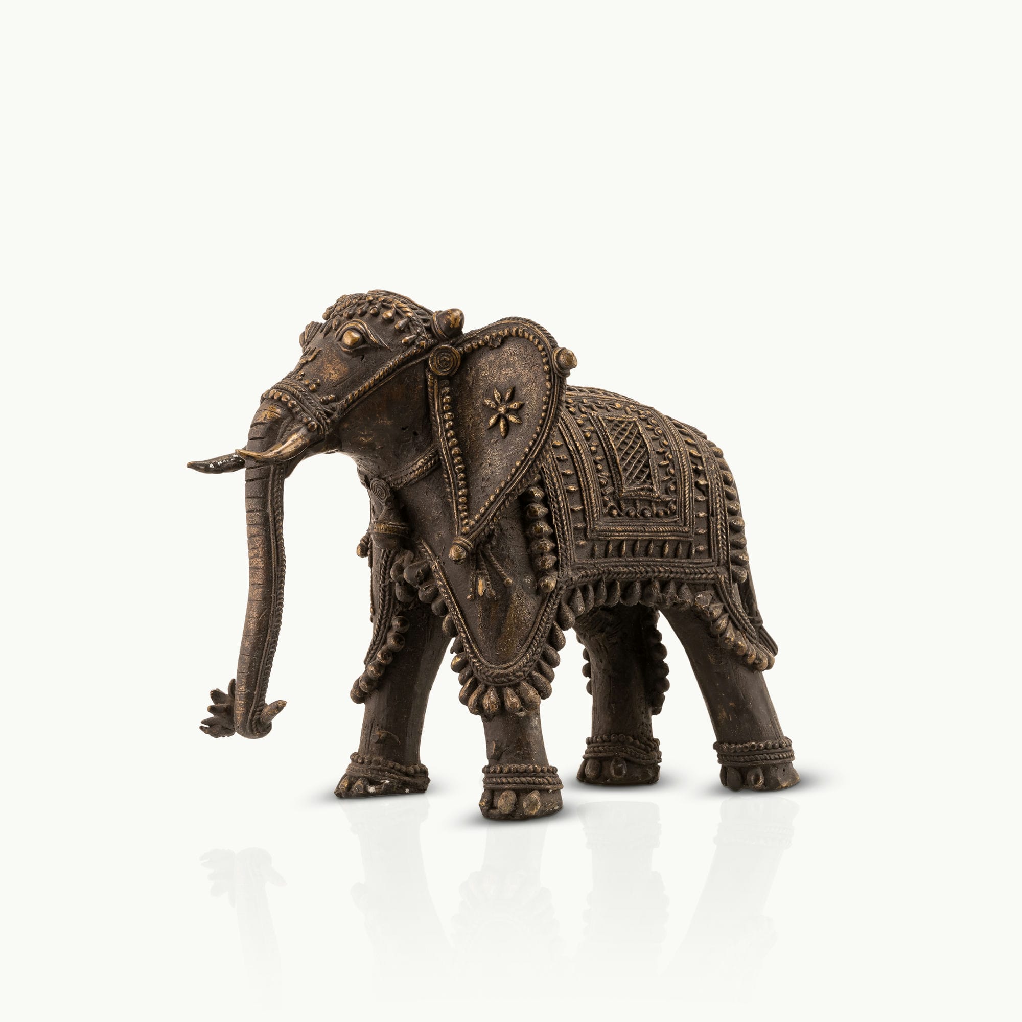 Indian ceremonial guardian decor showcasing intricate beadwork and dark patina for a solid mahogany desk or heritage office decor.