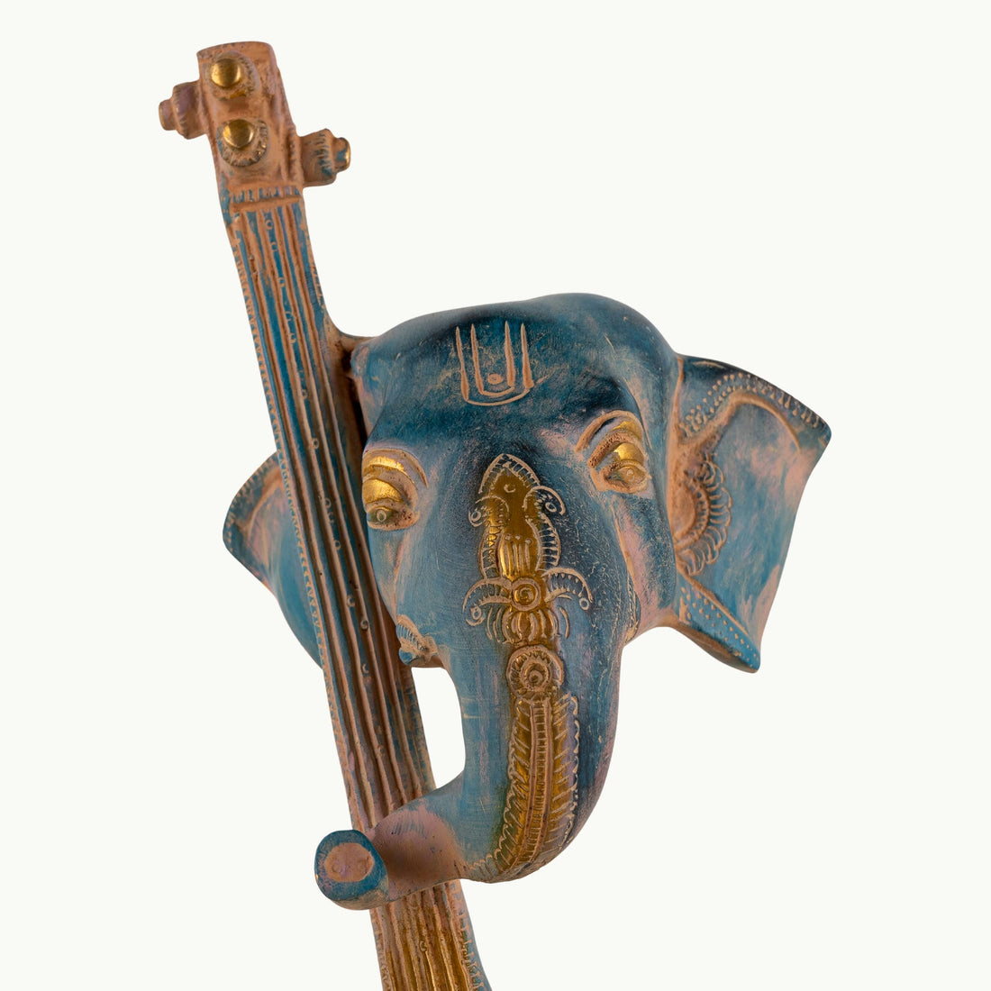 Painted Brass Musical Ganesha Sculpture integrated with a Veena on a minimalist credenza