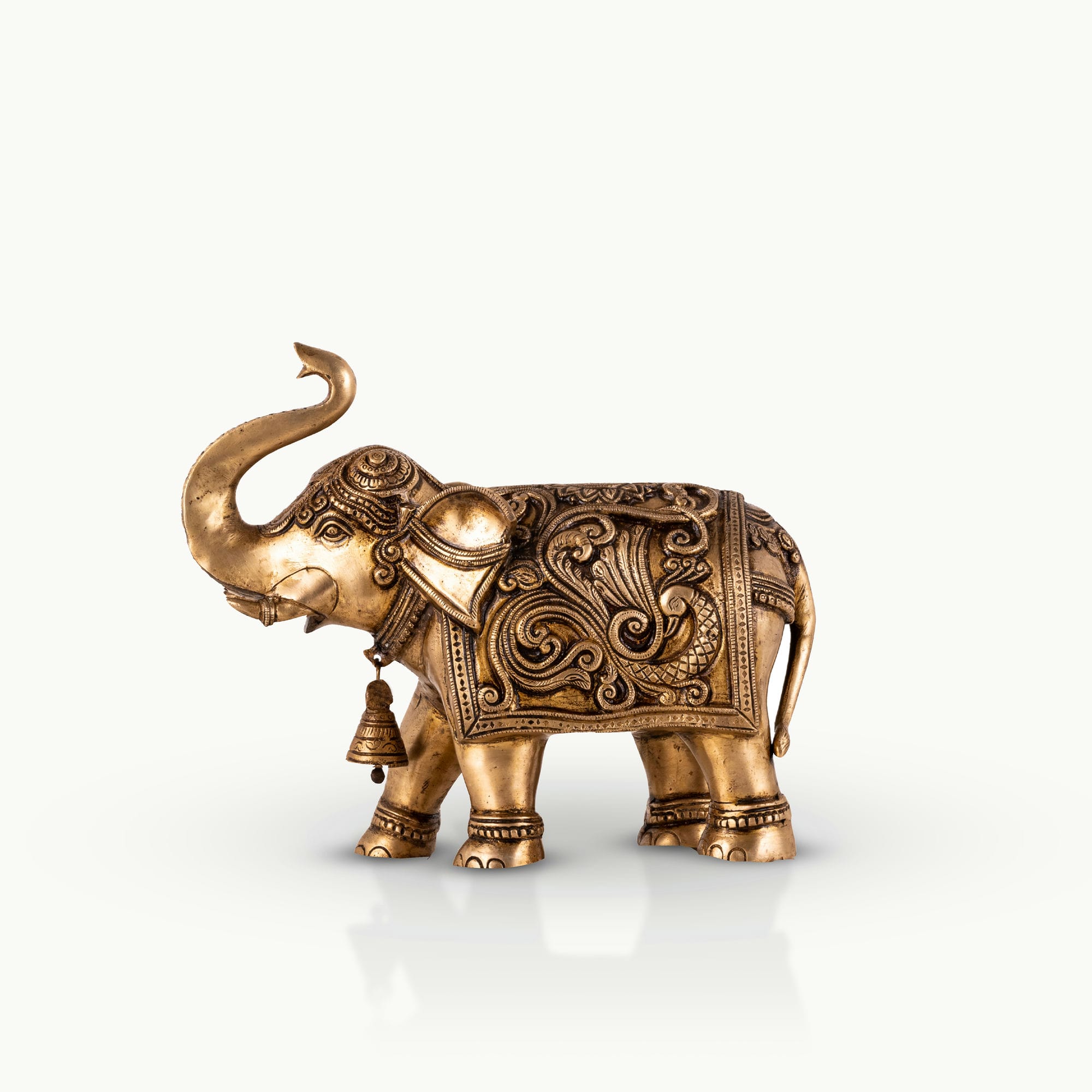 Engraved Golden Brass Elephant with a raised trunk for a dark walnut executive desk.