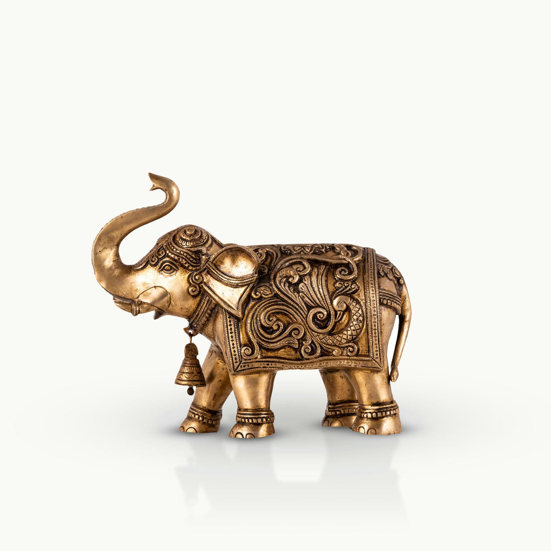 Engraved Golden Brass Elephant with a raised trunk for a dark walnut executive desk.