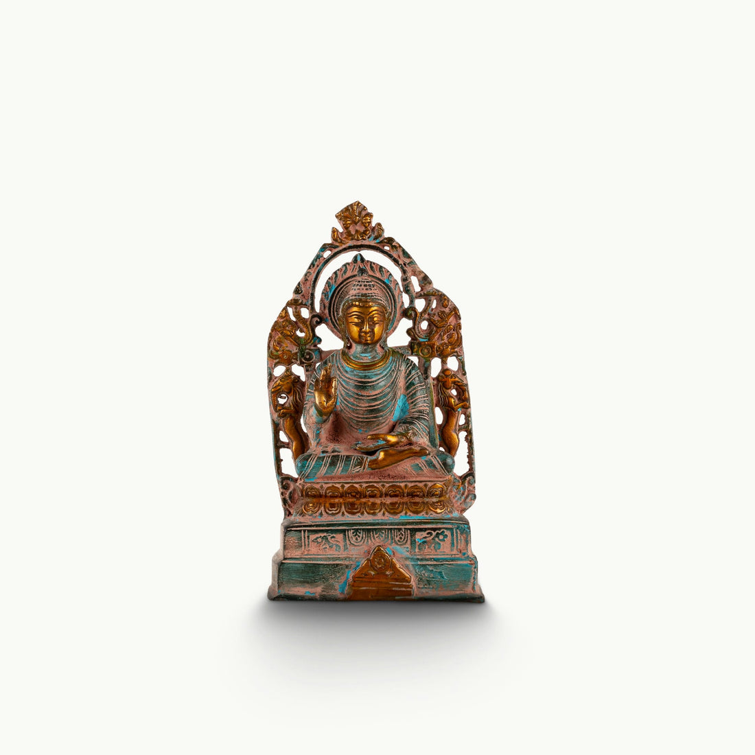 Distressed Brass Buddha Statue with Halo radiating quiet authority on a quiet study bookshelf. 