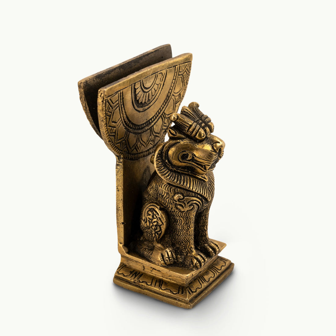 Antique Brass Lion Card Holder standing as a stoic authority on a modern glass console. 
