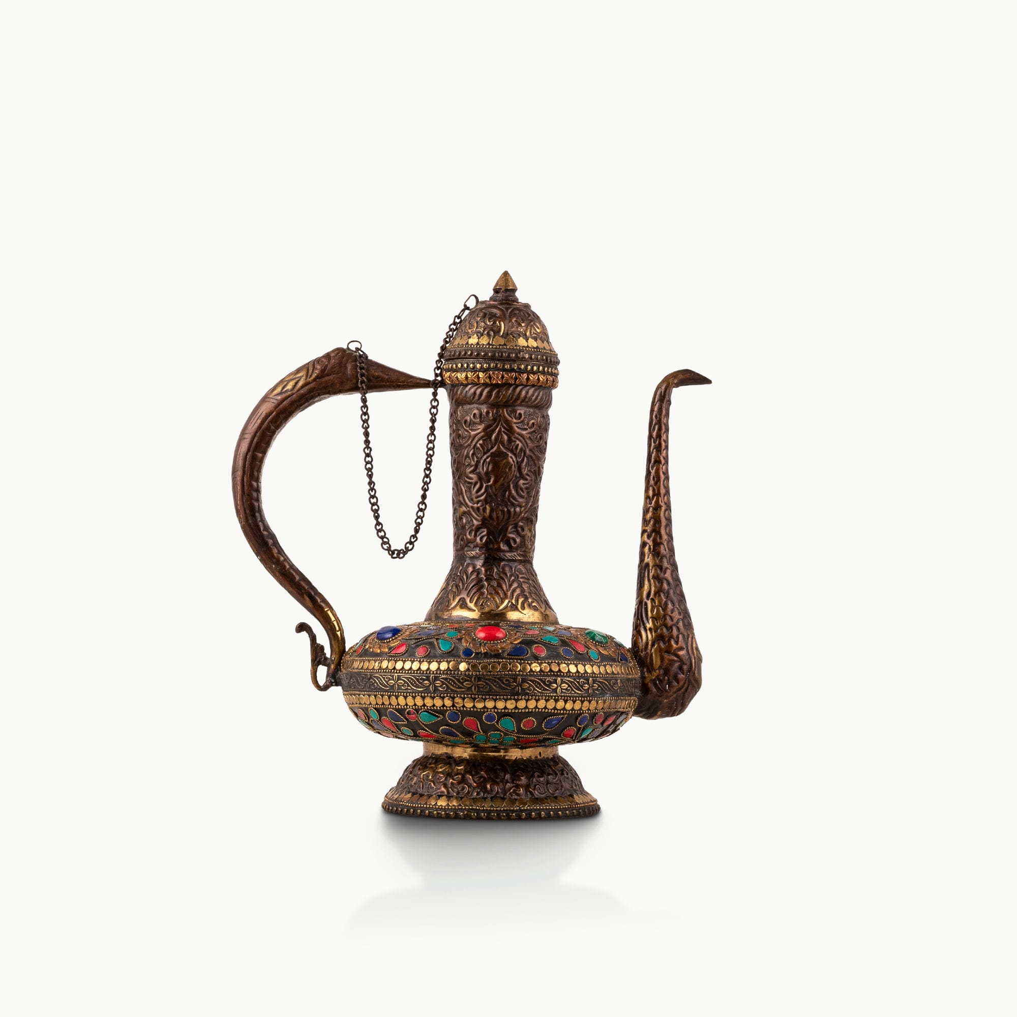 Stone Inlay Antique Brass Ewer featuring a stylized avian handle for a dark walnut sideboard.