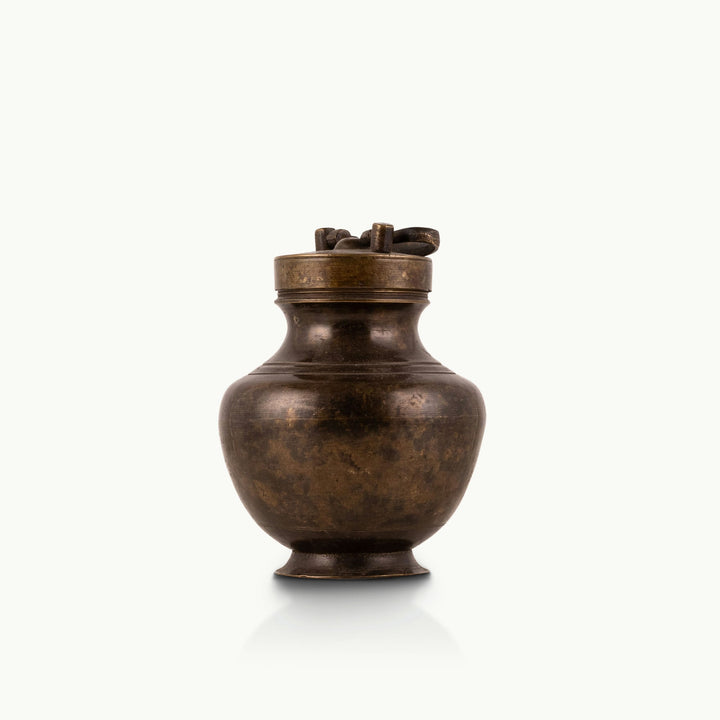 Antique Brass Surma Container with a tiny finger loop for a mirrored dressing tray.
