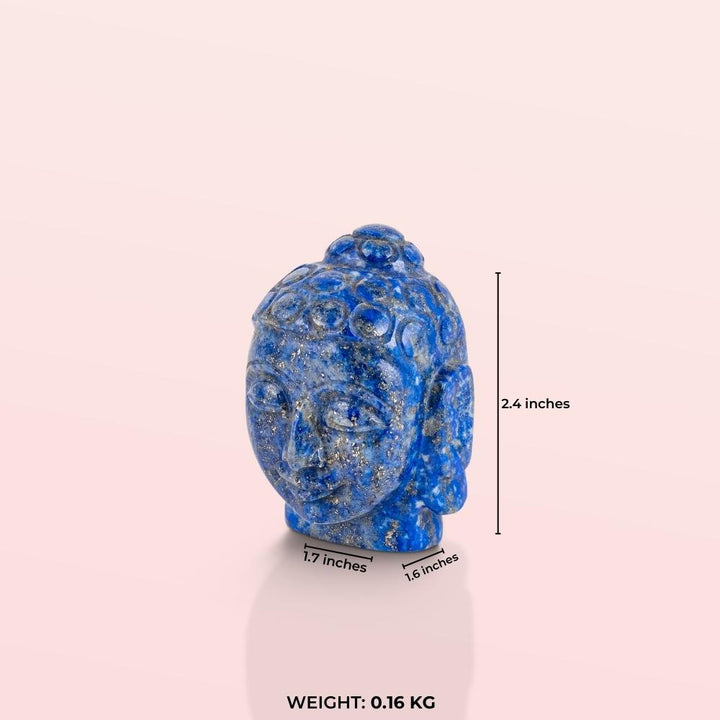 Carved lapis stone Buddha head with a polished ultramarine semi-precious stone surface.
